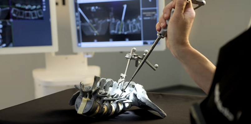 Hands using a tracked instrument with a spine model and navigation displays