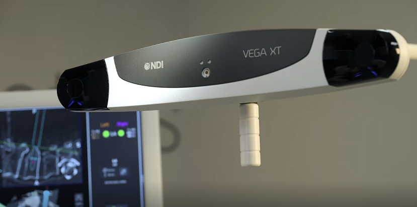 NDI Vega XT optical tracking camera with navigation display in the background